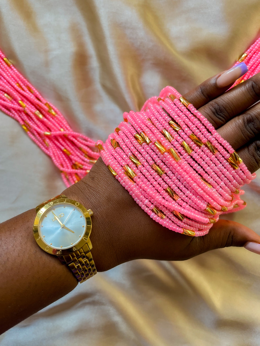 Pink and gold african waist beads. Top view