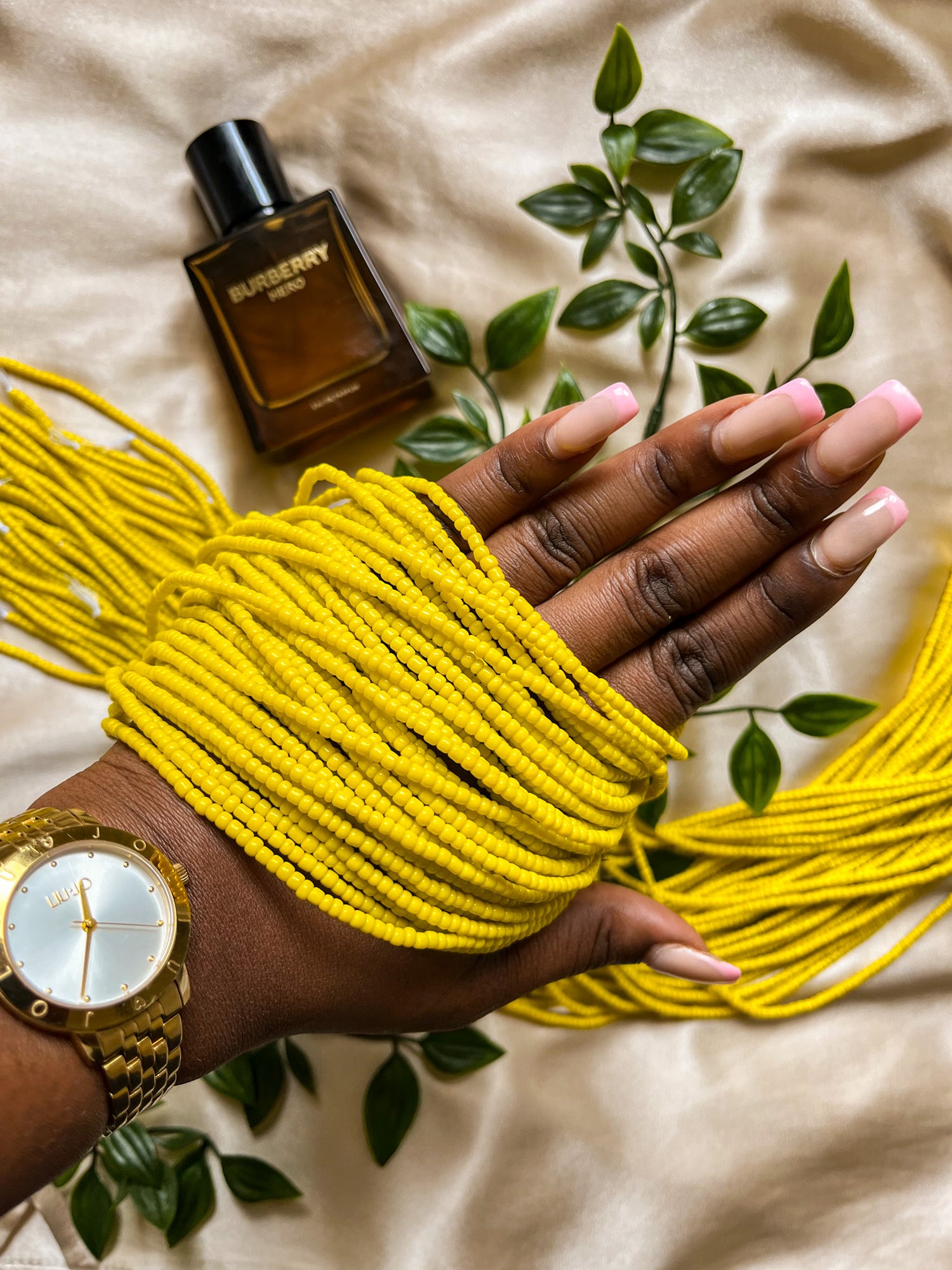 yellow waist beads. Close up