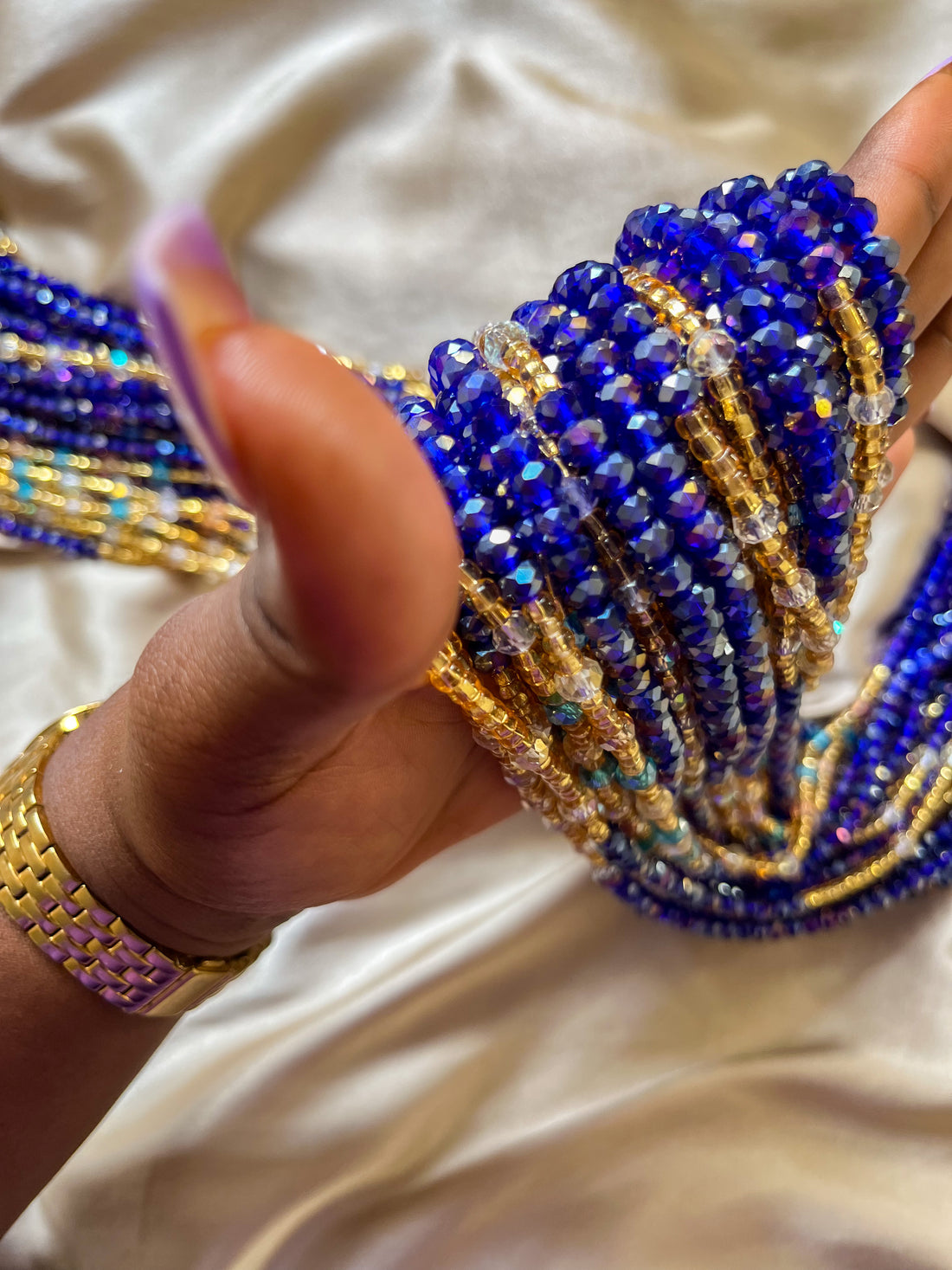 deep blue and gold african waist beads. side view