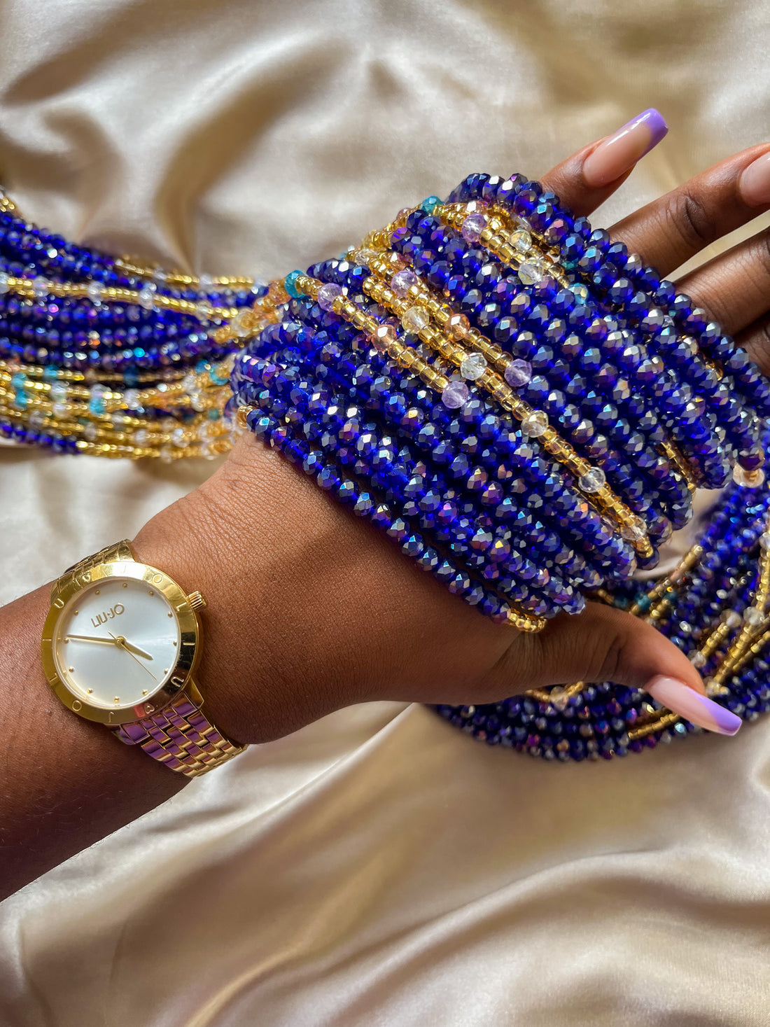 deep blue and gold african waist beads. Close up