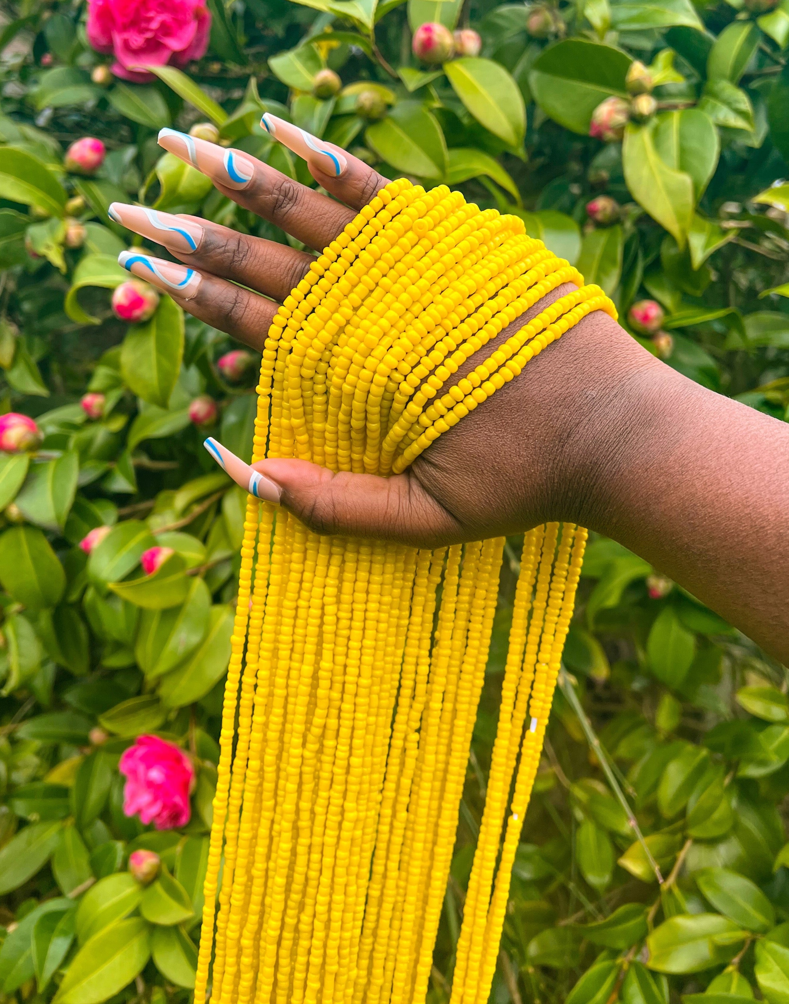 yellow waist beads. Front view