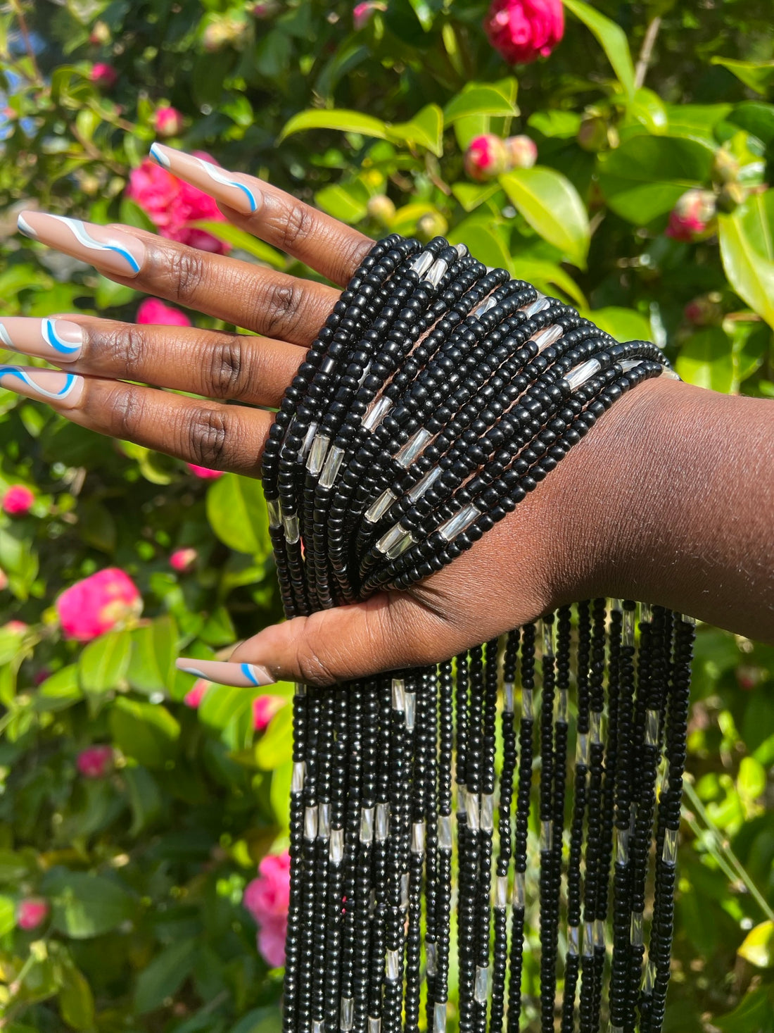 black and silver african waist beads. Close up